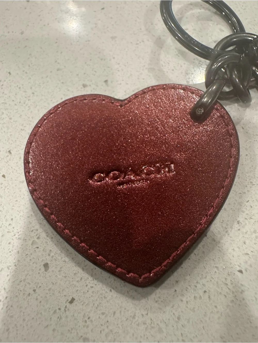 Coach red metallic